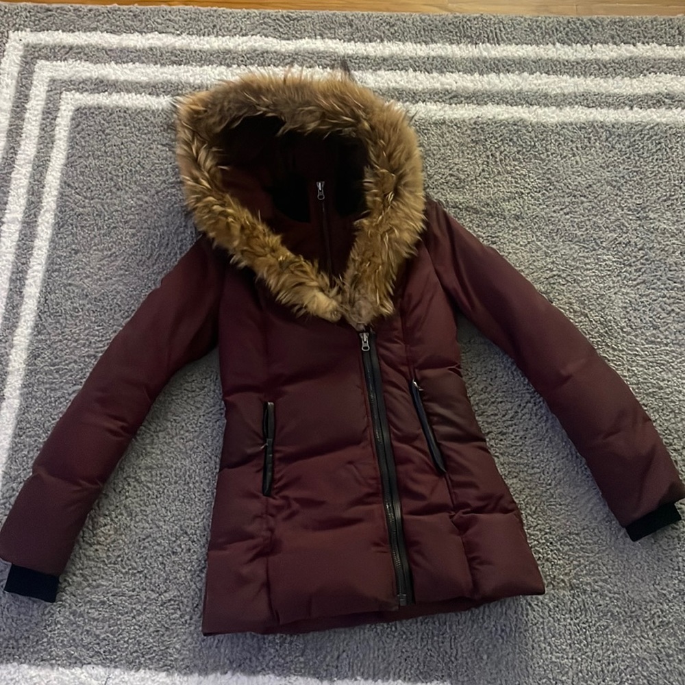 I am selling a Pre owned Burgundy Mackage coat Size extra small.